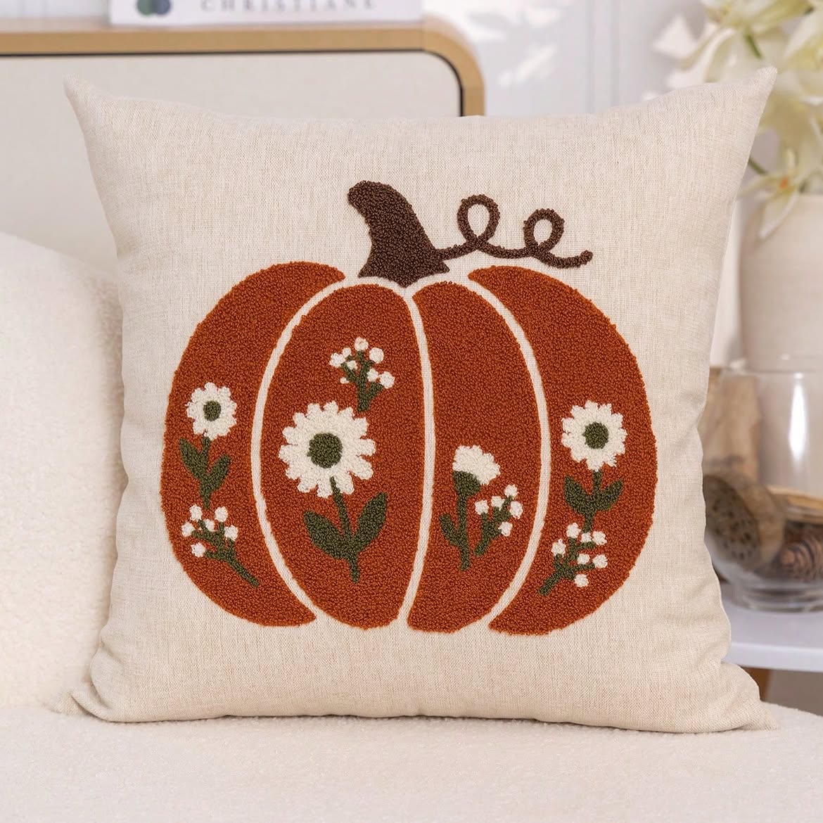 Floral pumpkin punch needle cushion cover in cream - burnt orange pumpkin with white daisy blooms on natural linen base