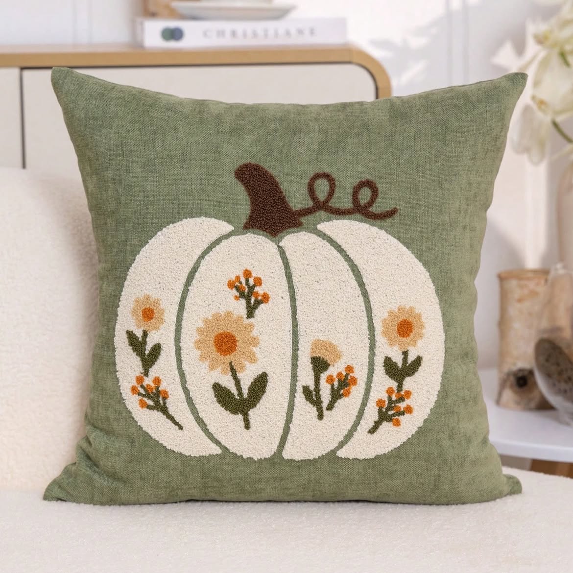 Floral pumpkin punch needle cushion cover in burnt orange - cream pumpkin with golden daisy blooms on terracotta linen base