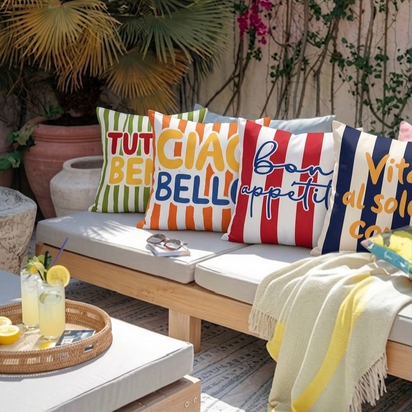 Outdoor seating area with colorful pillows.