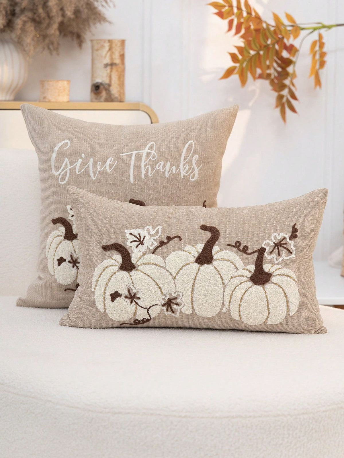 Give Thanks embroidered pumpkin pillow cover set in natural linen on white sofa - square and lumbar