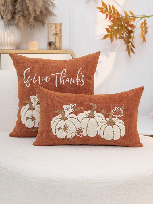 Give Thanks embroidered pumpkin pillow cover set in rust orange on white sofa - square and lumbar