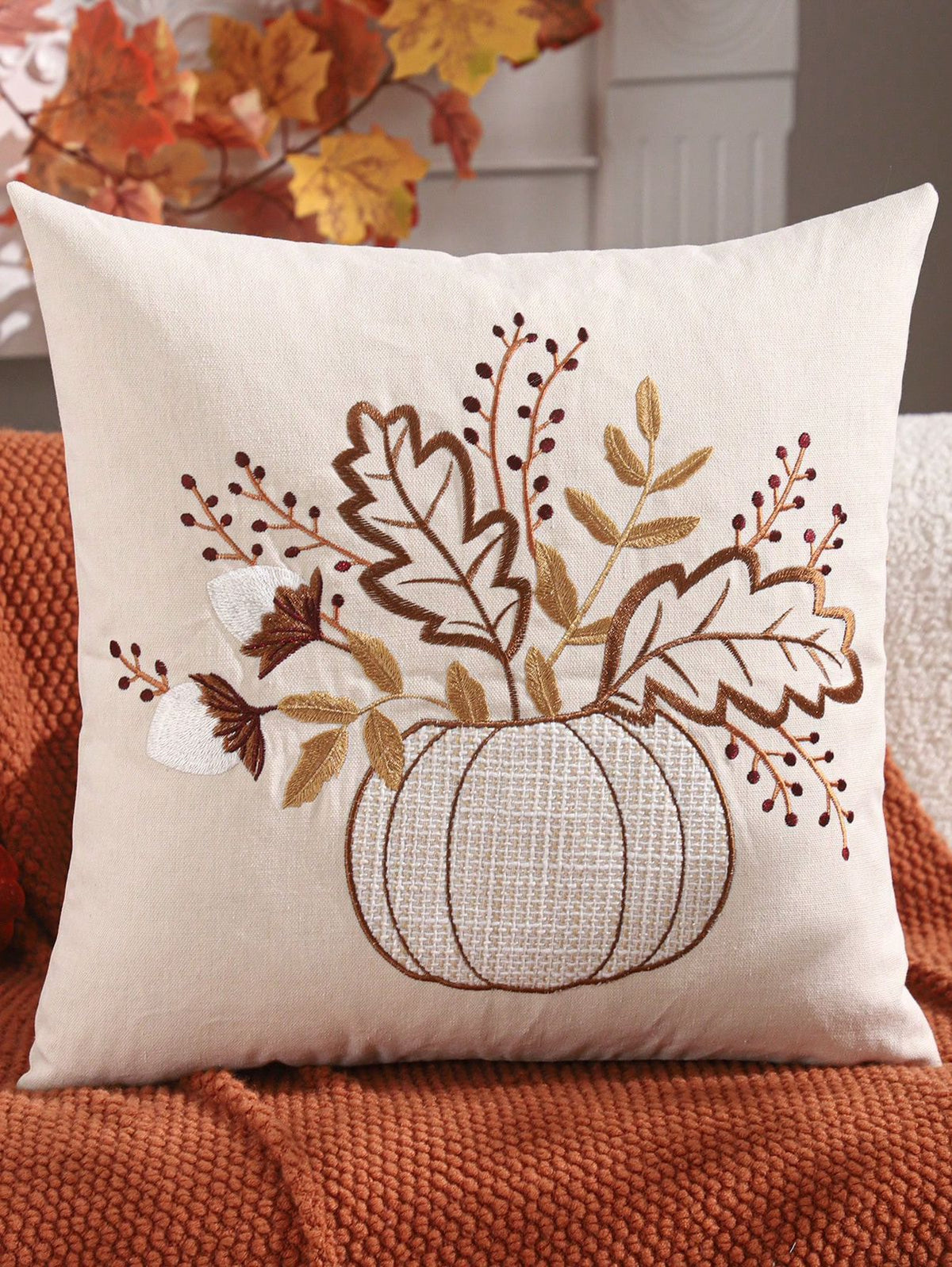 Design C: White burlap pumpkin vase with embroidered autumn leaves, red berries, and cotton bolls bouquet on cream pillow cover