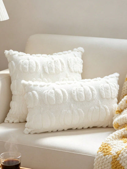 White plush faux fur scallop bobble pillow covers in square and lumbar sizes on cream sofa