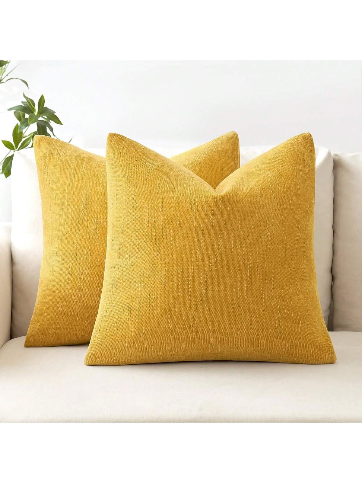 Mustard yellow textured linen look throw pillow cover on cream sofa